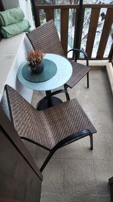 a patio with a table and two chairs and a table at Arboro Borovets Gardens E43 in Borovets