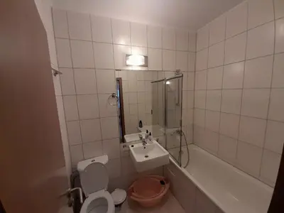 a bathroom with a toilet and a sink and a tub at SNOW PEAK TODORKA APARTAMENT /NEXT TO THE LIFT/ 6 PERSONS in Bansko
