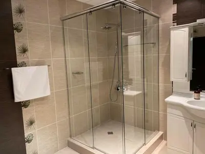 a shower with a glass door in a bathroom at Sana Ski apartment 620 in Flora, Borovets in Borovets