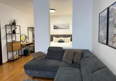 a living room with a couch and a bed at Sana Ski apartment 620 in Flora, Borovets in Borovets