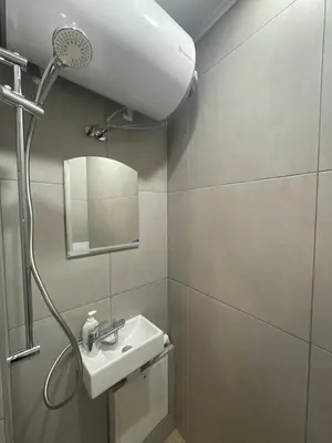 a bathroom with a sink and a shower at Top Center 2-BR Apartment with lovely Outdoor Area in Plovdiv