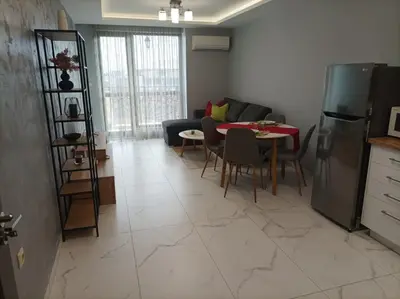 a living room with a couch and a table at One Bedroom Apartment 37- Trakia 54 А in Plovdiv