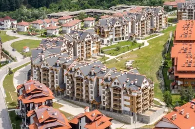 an aerial view of a large apartment complex with orange roofs at Secluded Mountain Cozy Studio with Fireplace in Bansko