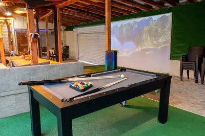 a ping pong table with a ball on top of it at Guest House Galabnik, Bulgaria in Gŭlŭbnik