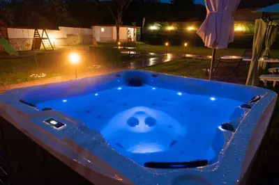 a jacuzzi tub with a smiley face in the middle at Guest House Galabnik, Bulgaria in Gŭlŭbnik