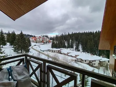 a view from a balcony of a resort in the snow at Apartment Love Pamporovo in Pamporovo