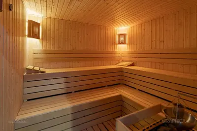 a large wooden sauna with a bench in it at 103 View Park Hotel in Panichishte