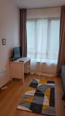 a room with a desk with a computer and a window at Semiramida Garden Apartment 12 in Borovets