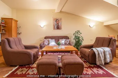a living room with two chairs and a table at MOMA - Charming home in the heart of Bansko Ancient Center in Bansko