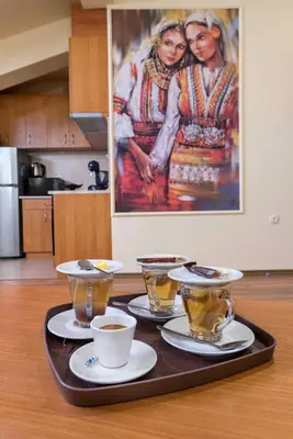 a tray with coffee and tea on a table at MOMA - Charming home in the heart of Bansko Ancient Center in Bansko