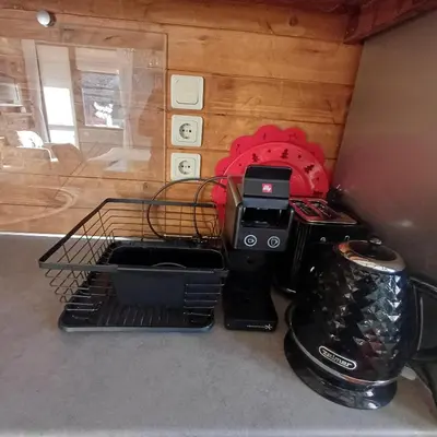 a kitchen counter with a coffee maker and a toaster at Mila VIP Apartment in Bansko