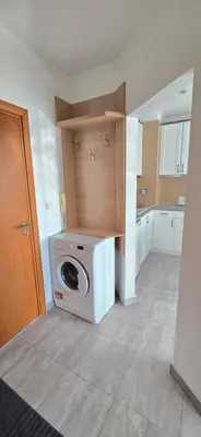 a kitchen with a washing machine in a room at Belvedere Holiday Club h 305 in Bansko
