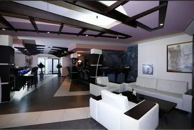 a large living room with white couches and a table at Belvedere Holiday Club h 305 in Bansko