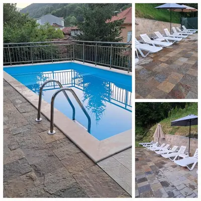 a swimming pool with white chairs and an umbrella at Зеления Осъм Green Osam in Chiflik
