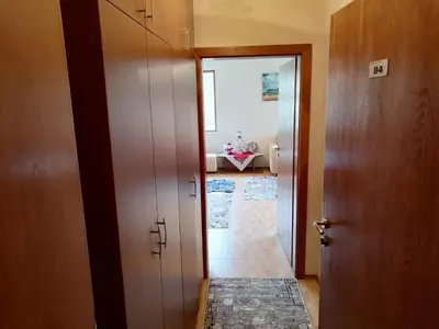 a hallway with a door leading to a living room at Apartment Dream Pamporovo in Pamporovo