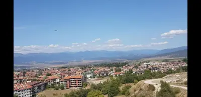 a view of a city with mountains in the background at Pirin and Bansko view Studio in Bansko