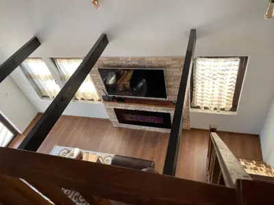 a view of a living room with a fireplace at Villa Elias in Zlatograd