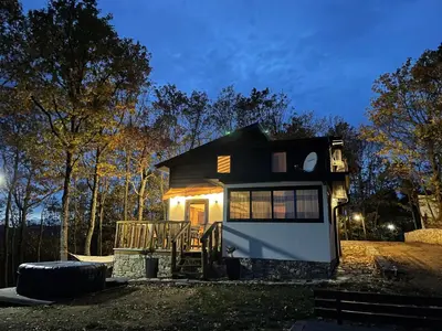 a small house with lights on the front of it at Villa Elias in Zlatograd
