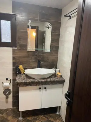 a bathroom with a sink and a mirror at Villa Elias in Zlatograd