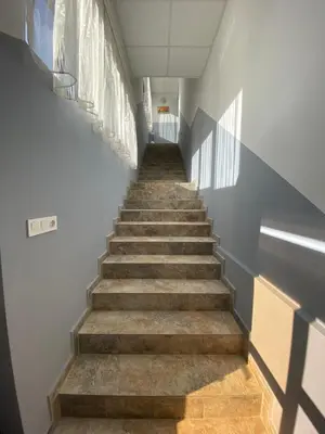 a staircase in a building with a stair case at Apartments EMIZA in Samokov