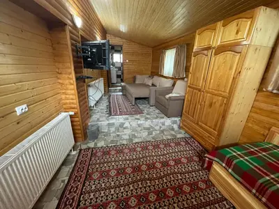 a small room with a couch and a living room at Къща за гости “Александър” in Velingrad
