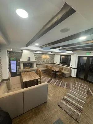 a living room with a couch and a table at Вила ИГЛИКА in Yagodina