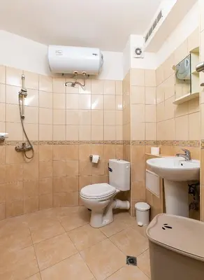 a bathroom with a toilet and a sink at Sunny 1BD Apartment in OLD TOWN by Flat Mаnager in Plovdiv