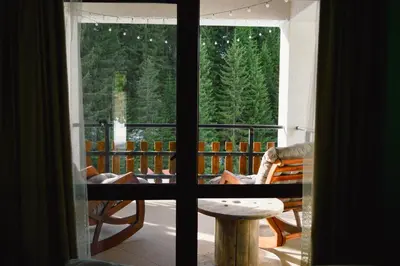 a room with a window looking out at a forest at Villa Tangra in Grashtitsa