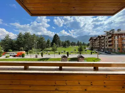 a view of a park from a bench at Pirin Golf SPA Studio Mountain View Compass Property in Bansko