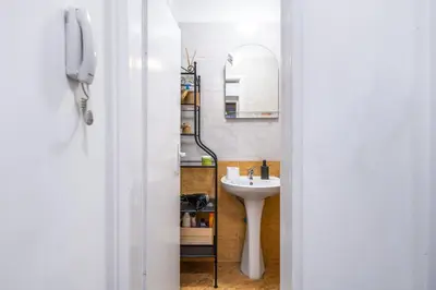 a bathroom with a sink and a mirror at Modern&Stylish Studio in City Centre by Flat Mаnager in Sofia