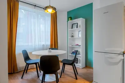 a dining room with a table and two chairs at Modern&Stylish Studio in City Centre by Flat Mаnager in Sofia