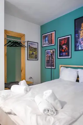 a bedroom with a bed with towels on it at Modern&Stylish Studio in City Centre by Flat Mаnager in Sofia