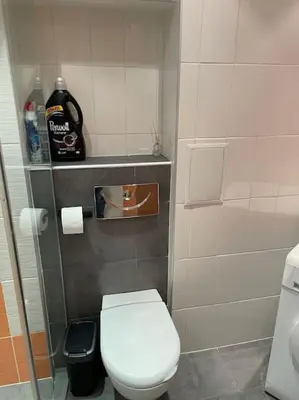 a small bathroom with a toilet and a sink at SliverCity next to paradise mall in Sofia