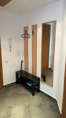 a room with a black table and a mirror at SliverCity next to paradise mall in Sofia