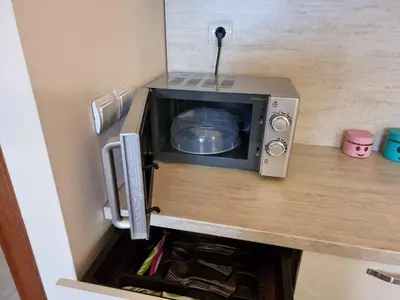a microwave sitting on top of a counter at Suite Roma 2 at Spa Club Bor in Velingrad