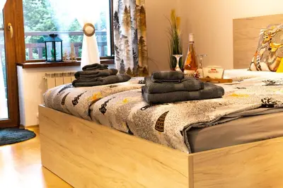 a bed with towels on top of it in a room at Premium mountain studio 40 Semiramida Gardens in Borovets