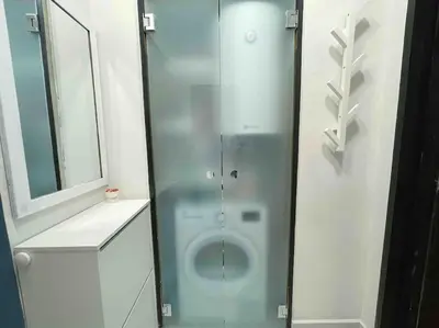 a glass shower in a bathroom with a mirror at Cozy & Boho Top Center Apartment in Sofia
