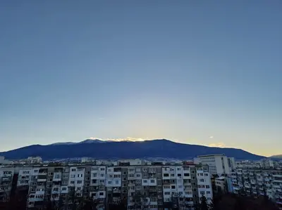 a city with buildings and mountains in the background at Very Spacious & Modern 3Bed near Airport & Centre in Sofia
