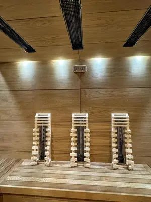 a room with a wooden wall with three white columns at Bóris House in Ognyanovo