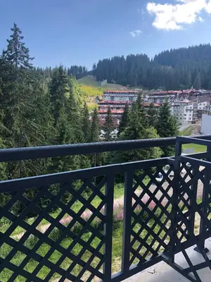 a balcony with a view of a city at Luxury Apartments Studenets in Pamporovo