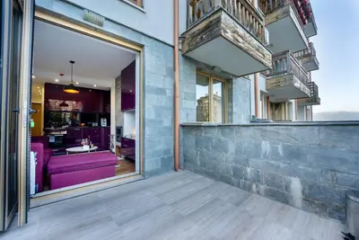 a view from the balcony of a house at Warm&Cozy Studio with Patio in Bansko