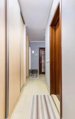 a hallway with a door and a table in a room at Dufti Home in Plovdiv Center & Old Town / Kapana in Plovdiv