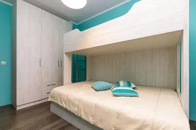 a bedroom with a bed with two pillows on it at Dufti Home in Plovdiv Center & Old Town / Kapana in Plovdiv