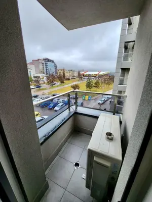 a balcony in a building with a view of a parking lot at Top location apartment in Sofia