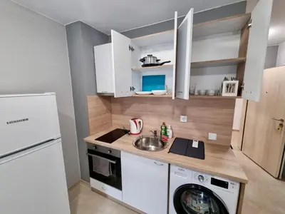 a kitchen with a sink and a washing machine at Top location apartment in Sofia