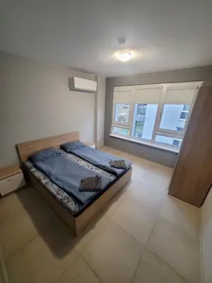 a bedroom with a bed and a window at Top location apartment in Sofia