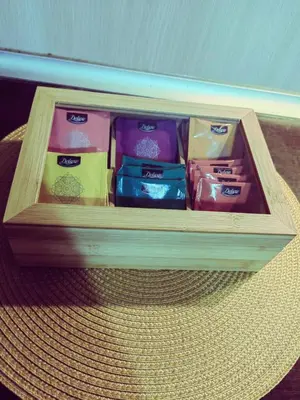 a wooden box with different colored items in it at Alexander Apartments Kyustendil in Kyustendil