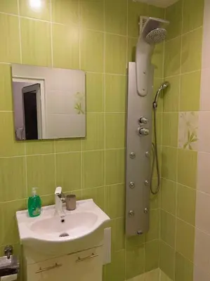 a bathroom with a shower and a sink at Alexander Apartments Kyustendil in Kyustendil