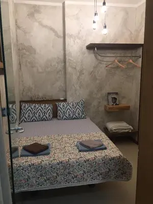 a bedroom with a bed with two towels on it at My place - 24h Self Check-in in Sofia