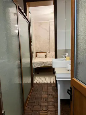 a bathroom with a sink and a mirror at My place - 24h Self Check-in in Sofia